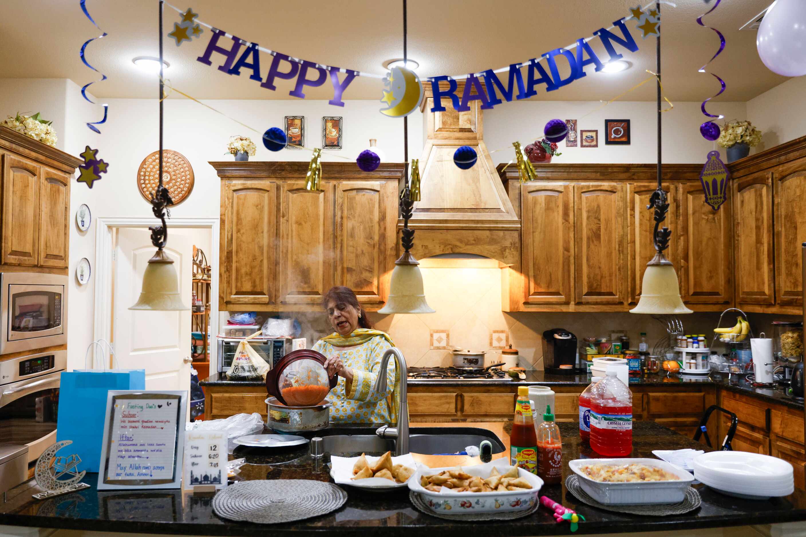 Navin Butt prepares, Zarda, Pakistani sweet rice for dessert, ahead of an Iftar gathering,...