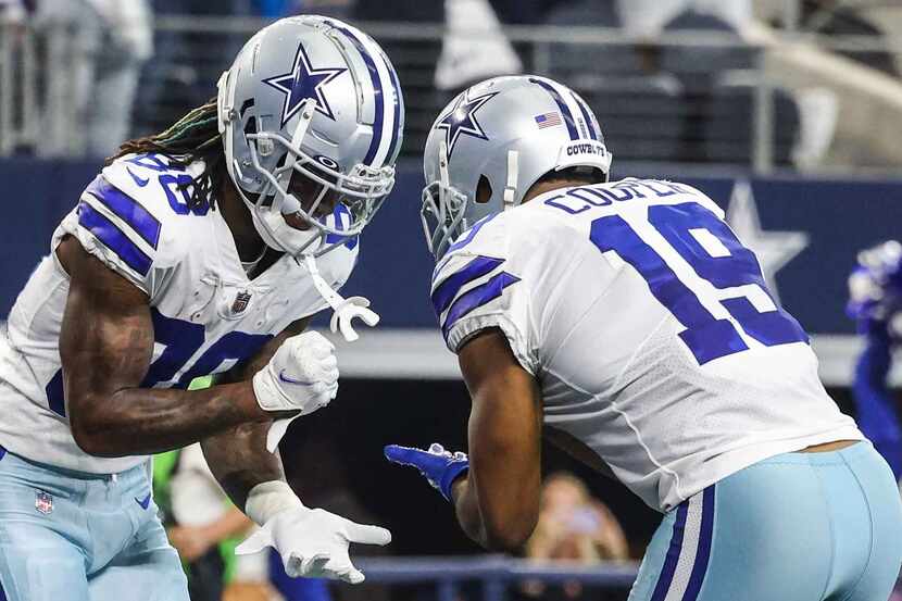 Dallas Cowboys' CeeDee Lamb (88) and Amari Cooper (19) celebrate a touchdown during the...