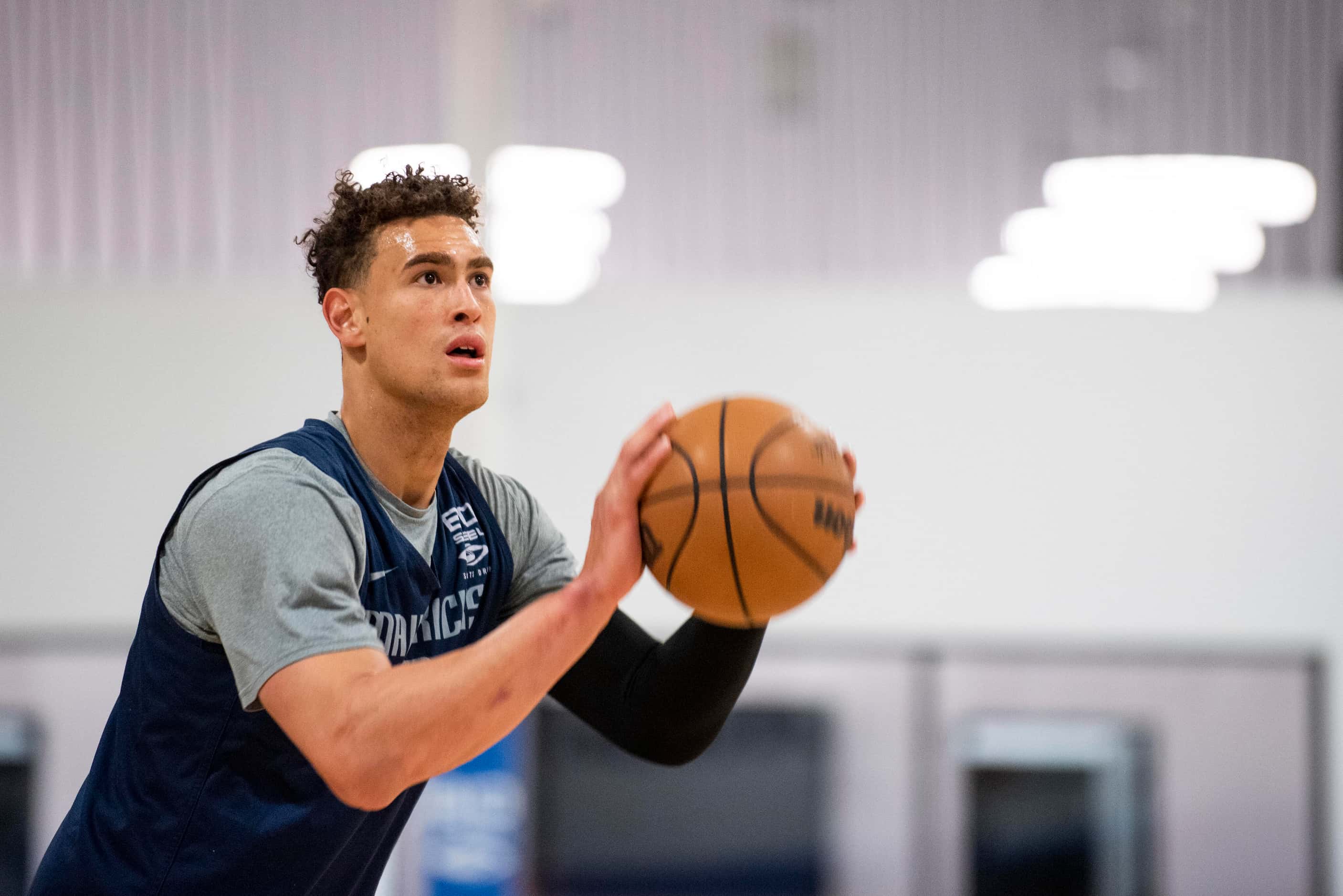 Dallas Mavericks center Dwight Powell (7) shoots a three-pointer during practice at the...