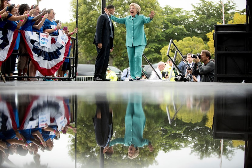 Hillary Clinton takes the rain-soaked stage at C.B. Smith Park in Pembroke Pines, Fla., on...