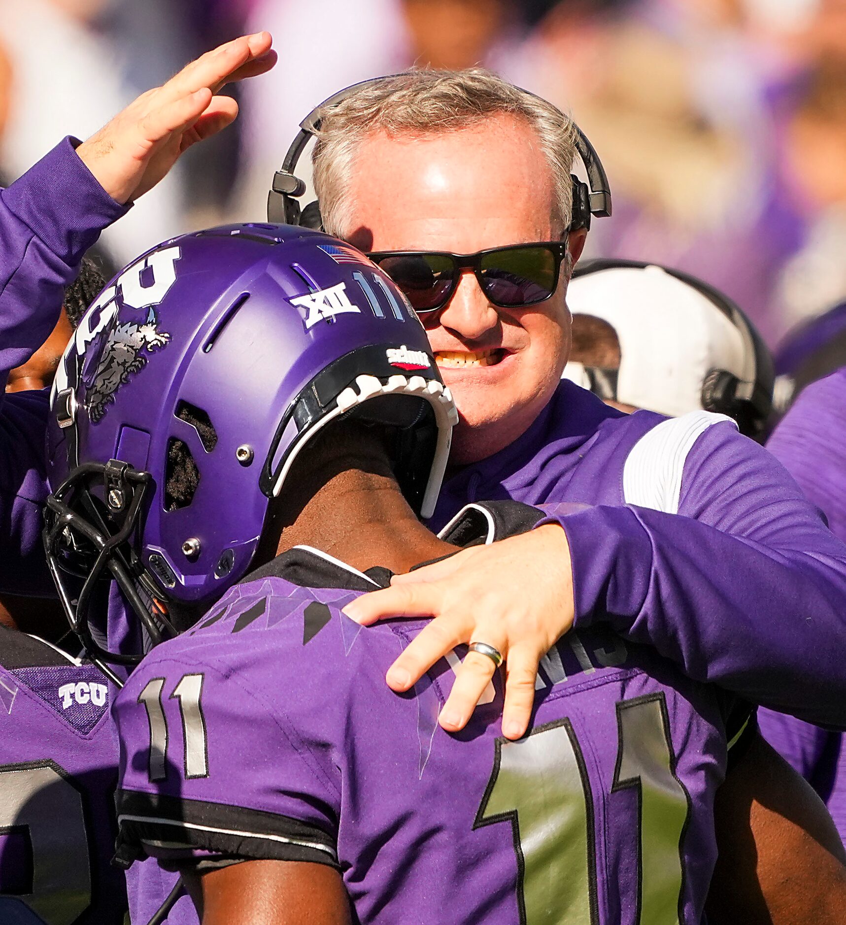 TCU head coach Sonny Dykes celebrates with wide receiver Derius Davis (11) after returned a...