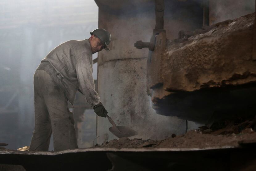 In this Saturday, Jan. 7, 2017 photo, a North Korean man works at the Chollima Steel Complex...