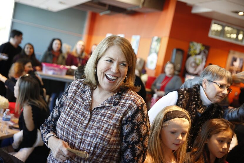 Suzy Cravens reacts after winning the Cookie Man category.