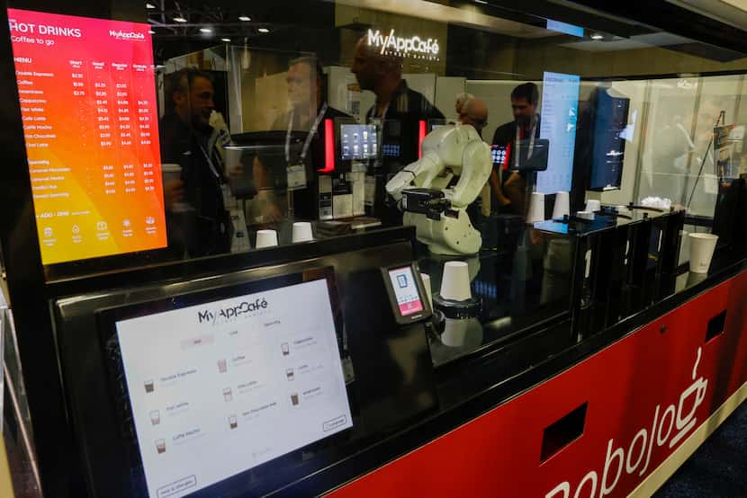 Robojo My App Café, an automated coffee kiosk, served coffee to an attendee during the...