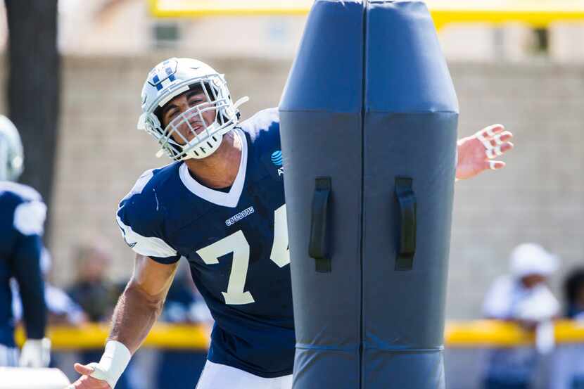 Dallas Cowboys defensive end Jalen Jelks (74) attacks a dummy during a morning practice at...
