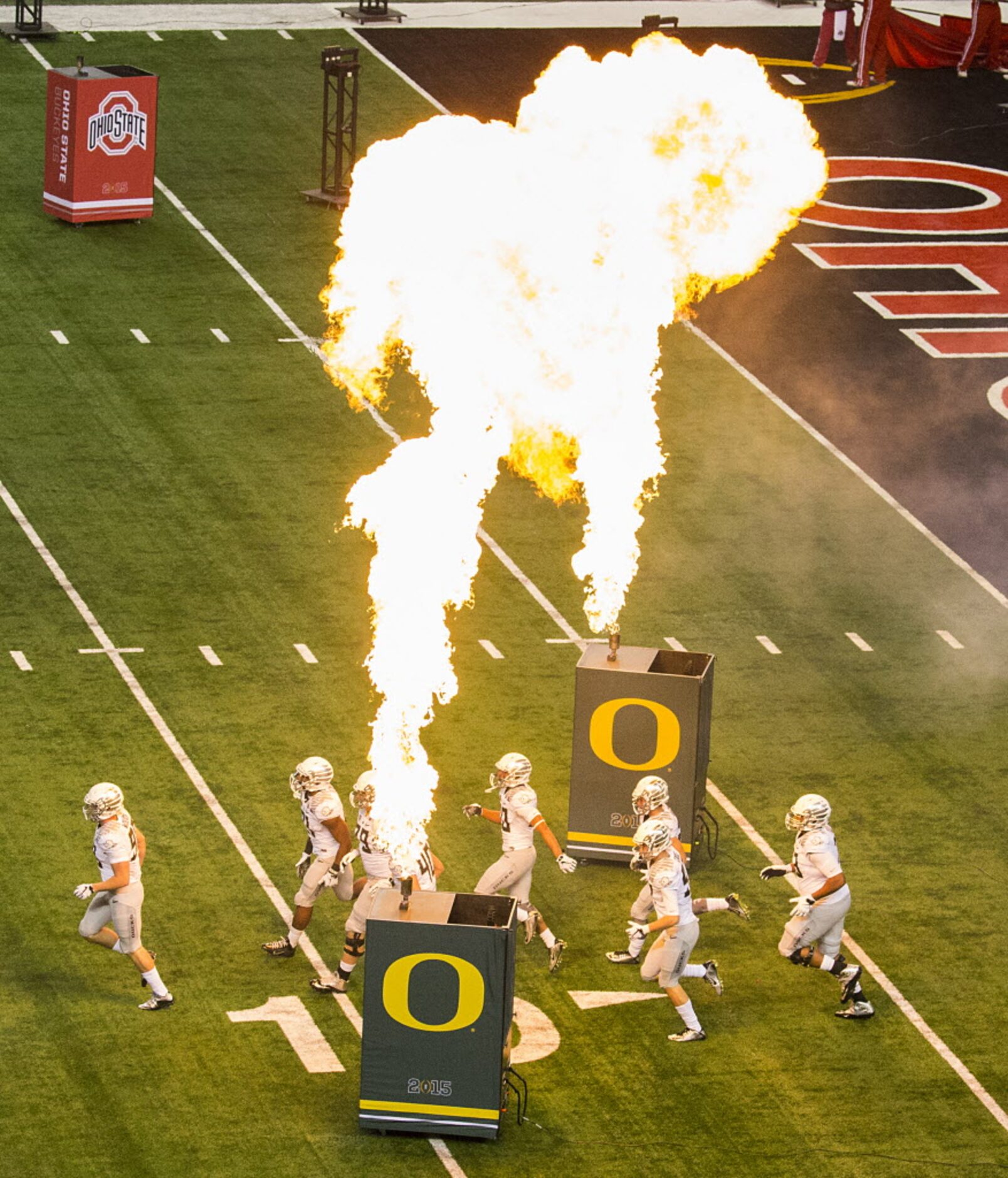 Oregon Ducks players take the field to face the Ohio State Buckeyes before the College...