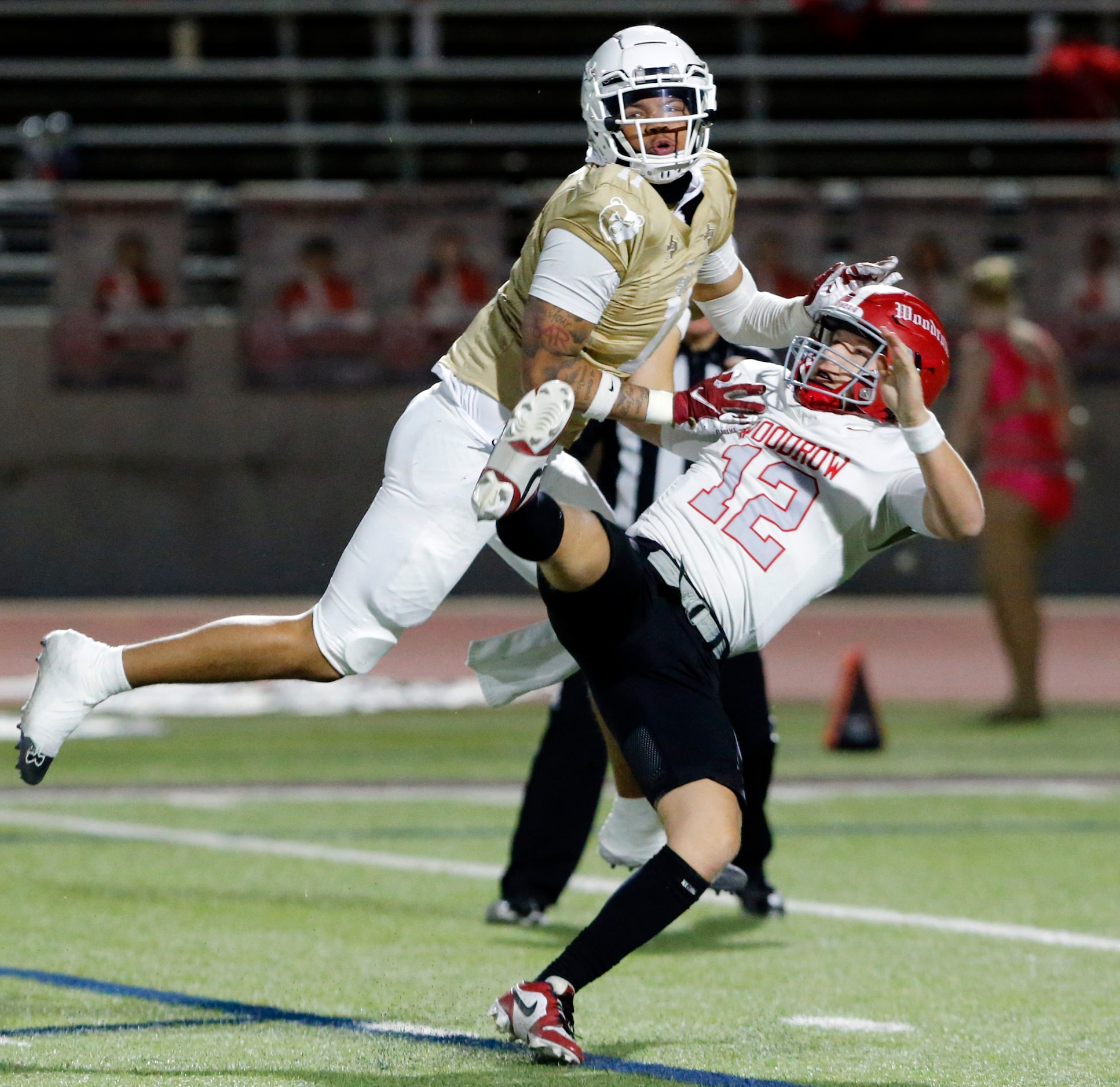 Woodrow Wilson High Kyle Trulock (12) is blitzed by South Oak Cliff High defender Jordan...