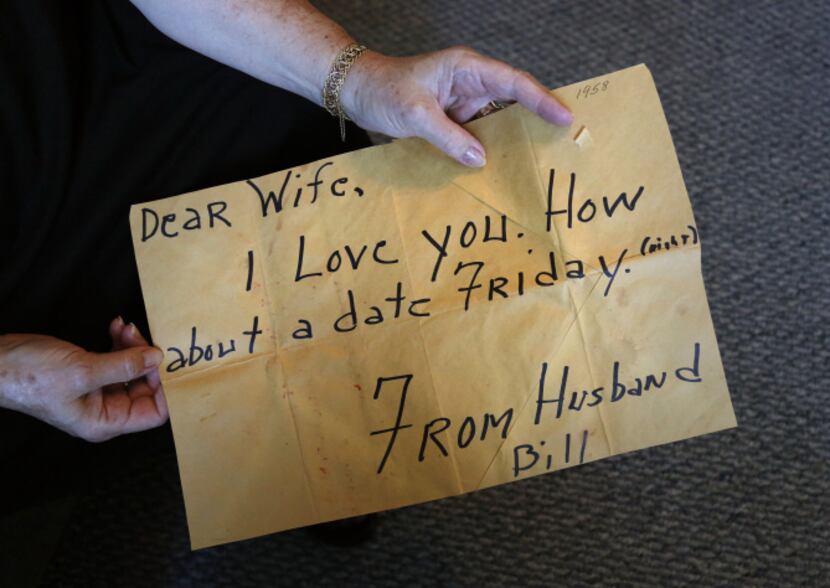 Joan Few shows the note that her husband Bill wrote for her in 1958 during the photo session...
