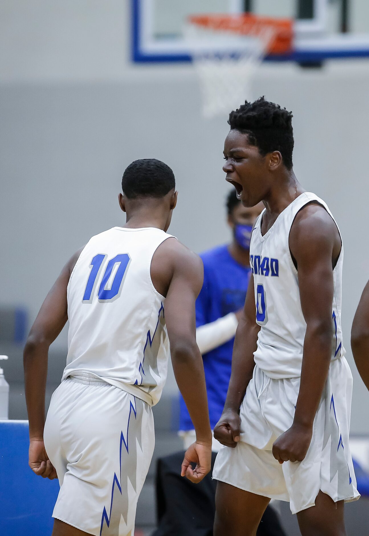 Conrad senior forward Kerric Saunders (10) is congratulated by senior forward Joe Joe...