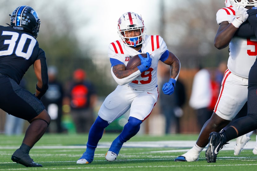 Duncanville running back Caden Durham (29) runs the ball up field past North Crowley...