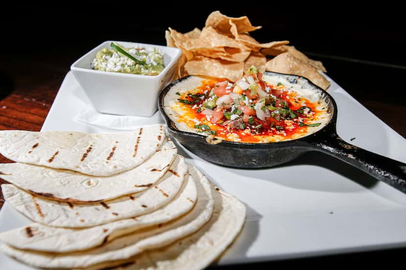 Rangers Republic serves Tex-Mex, like guacamole and queso fundido, pictured here.