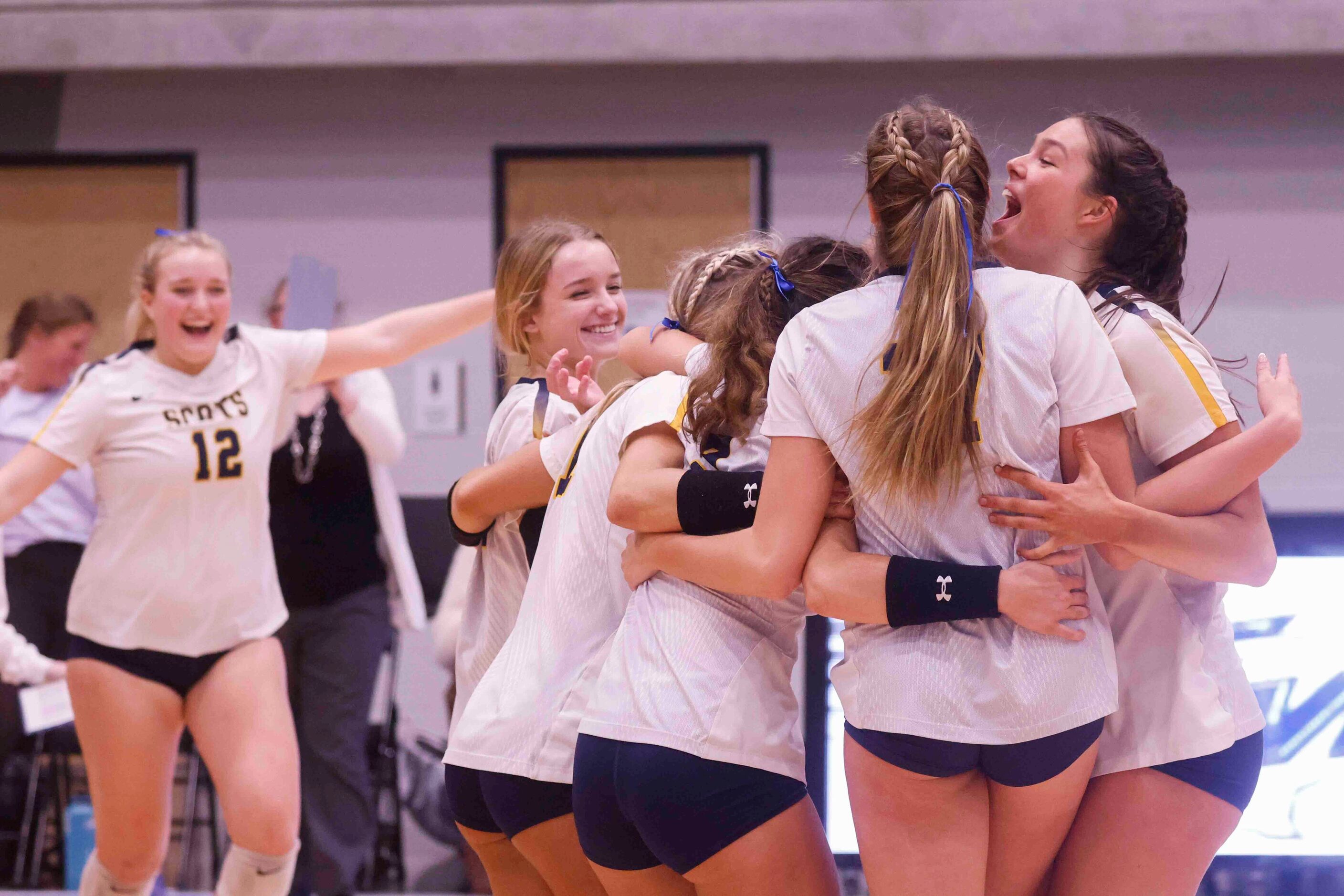 Highland Park players celebrate after winning against Flower Mound during a volleyball game...