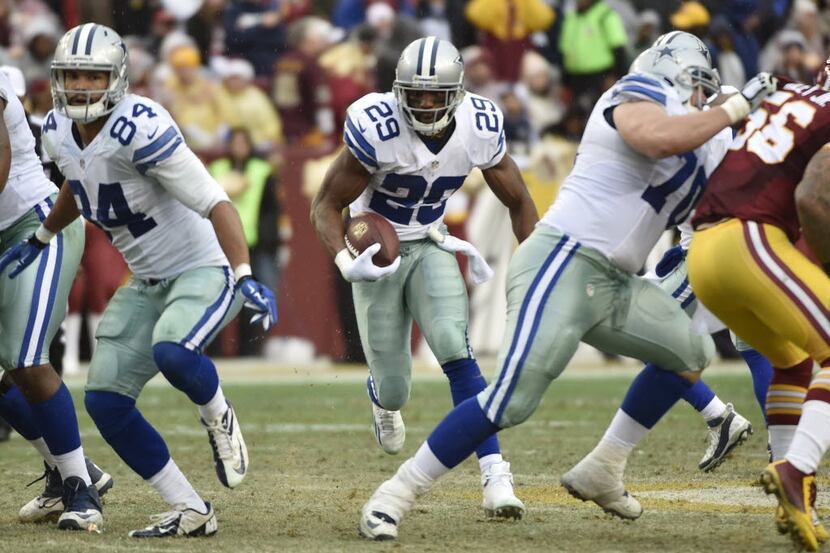 Dallas Cowboys running back DeMarco Murray (29) breaks through a hole created by  tight end...