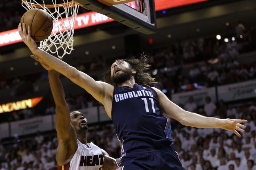 FILE - In this April 20, 2014 file photo, Charlotte Bobcats' Josh McRoberts (11) shoots over...