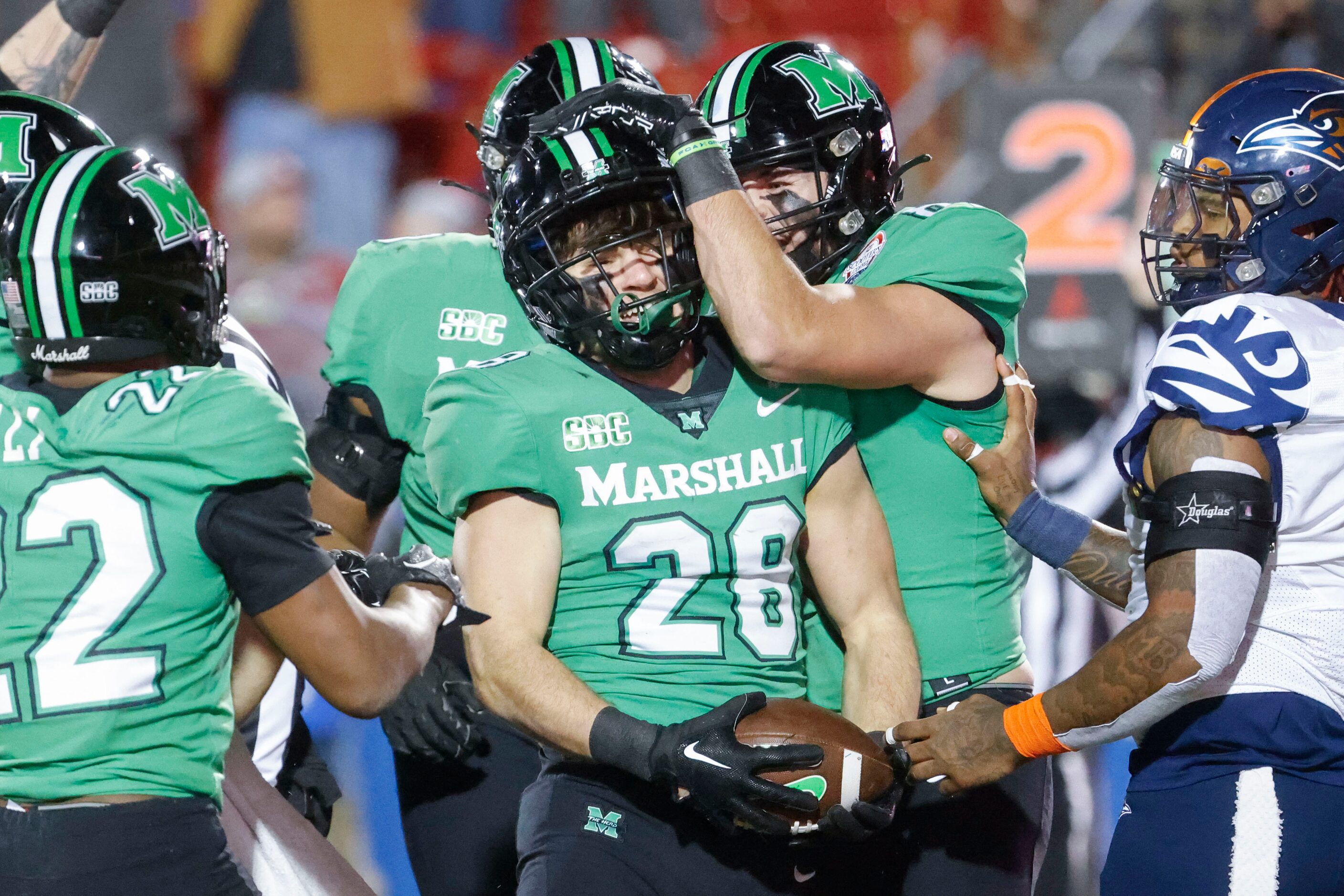 Marshall running back Ethan Payne (28) celebrates a touchdown against UTSA during the first...