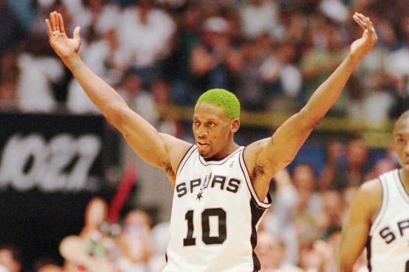 San Antonio's Dennis Rodman celebrates after scoring a basket in the second half of the...