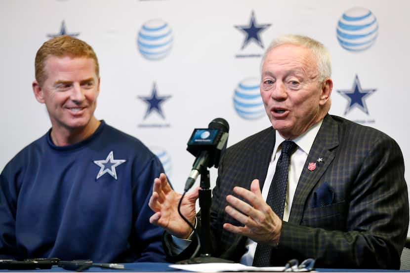 Dallas Cowboys owner Jerry Jones (right) holds court with the media after announcing a...