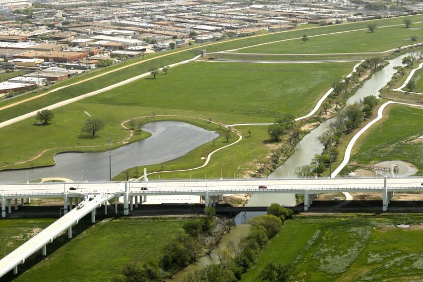 The new Sylvan Avenue bridge and Trammell Crow Park is seen northwest of downtown Dallas...