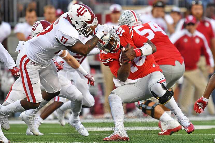 COLUMBUS, OH - OCTOBER 8:  Chris Covington #17 of the Indiana Hoosiers wrestles down J.T....