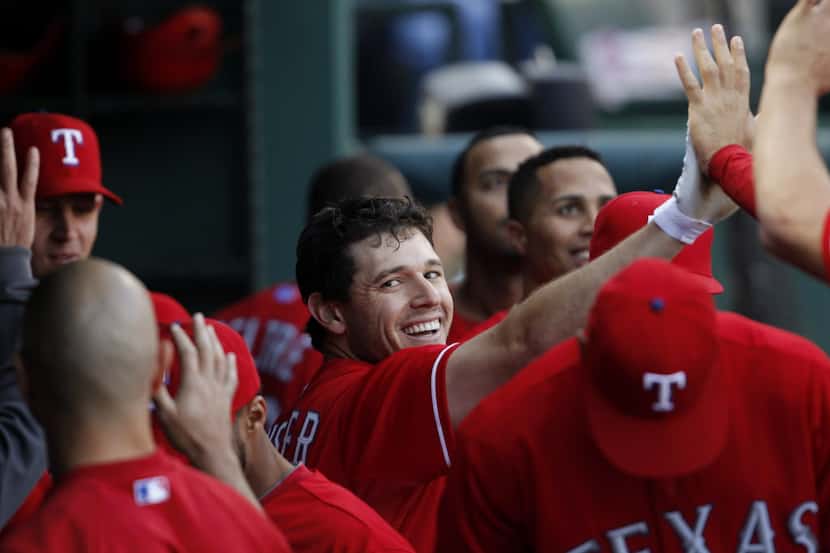 Texas Rangers second baseman Ian Kinsler (5) celebrates with teammates after hitting a home...