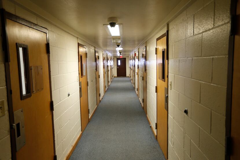 A hallway in one of the dorms at the Gainesville State School on Feb. 26, 2018. Each room...