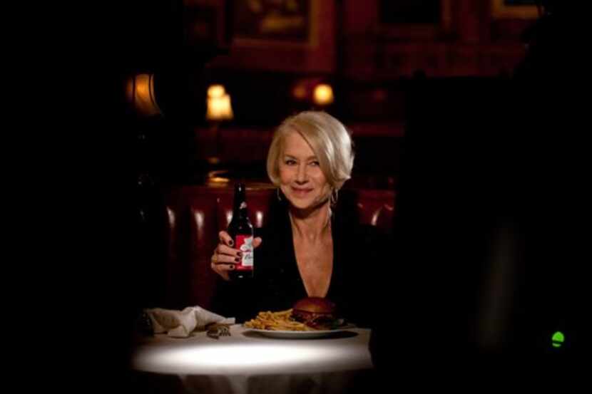This photo provided by Anheuser-Busch shows actress Helen Mirren in a Budweiser ad for Super...