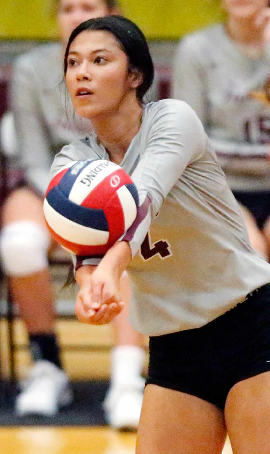 Heritage High School outside hitter Tatum Allberg (4) passes a serve during game one as...