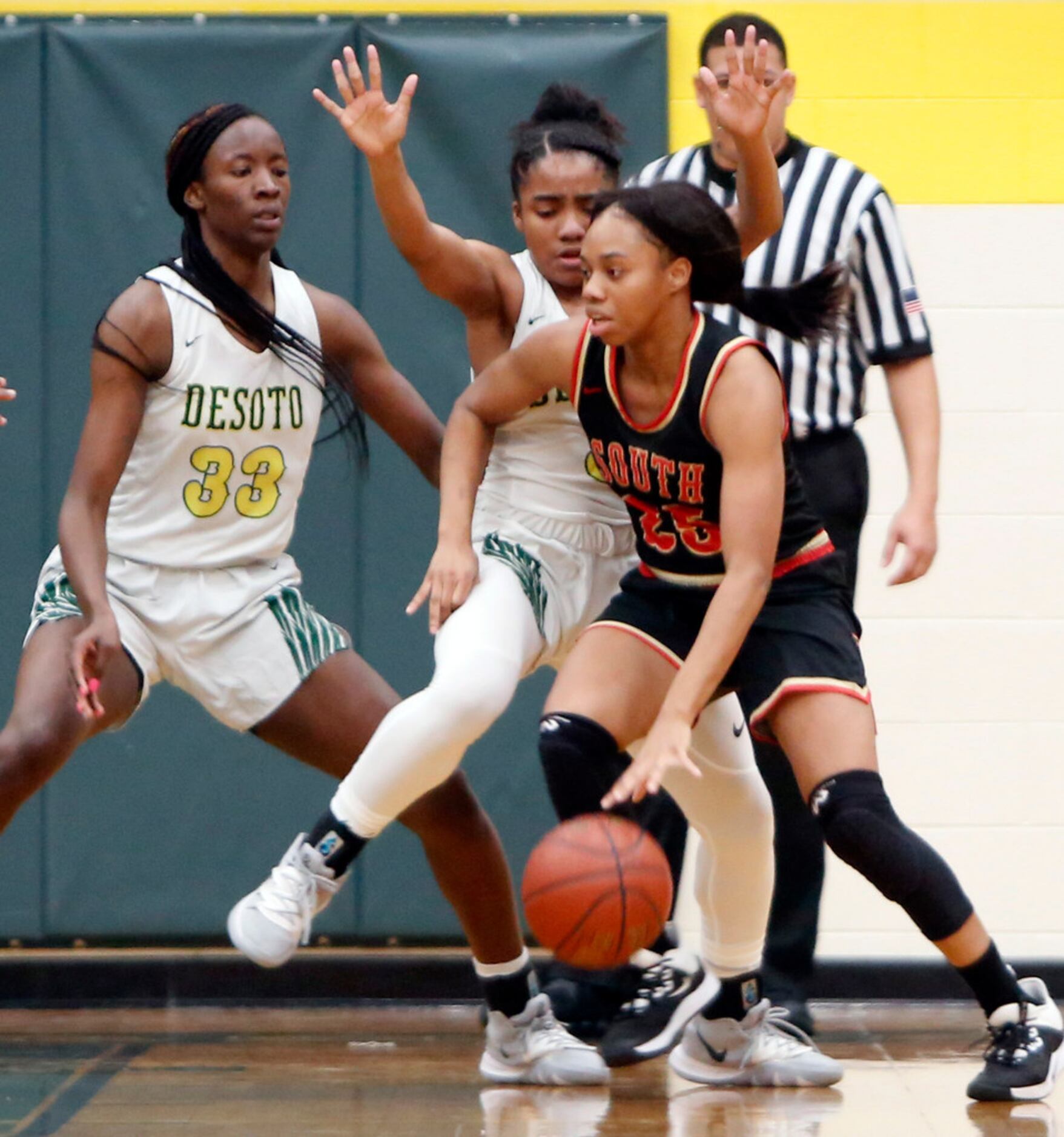 South Grand Prairie's Madison Jean-Louis (25) finds driving the ball challenging against the...