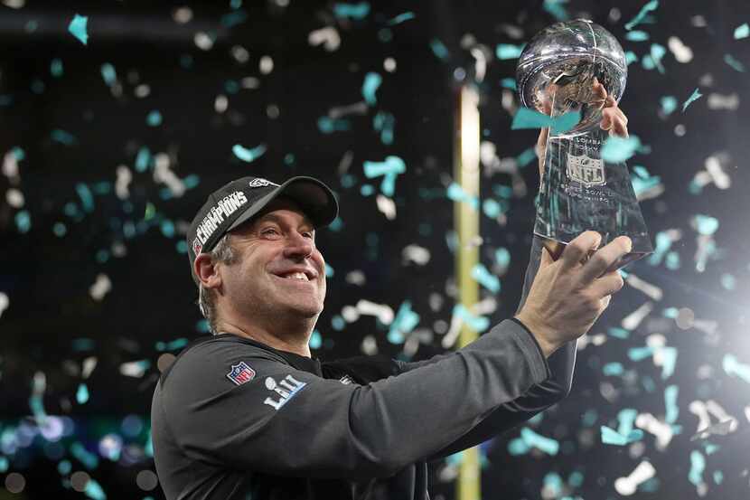 Philadelphia Eagles head coach Doug Pederson hoists up the Lombardi trophy during the...