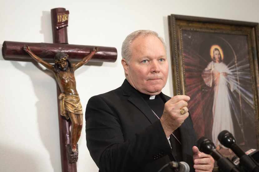 Bishop Edward Burns talks to reporters during a news conference at St. Cecilia's on Aug. 19.