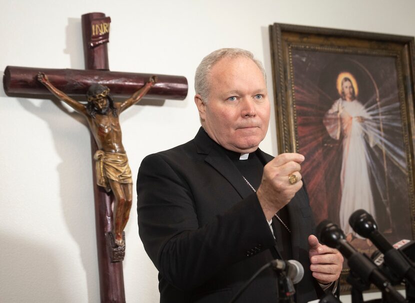 Bishop Edward Burns talks to reporters during a news conference at St. Cecilia's on Aug. 19.