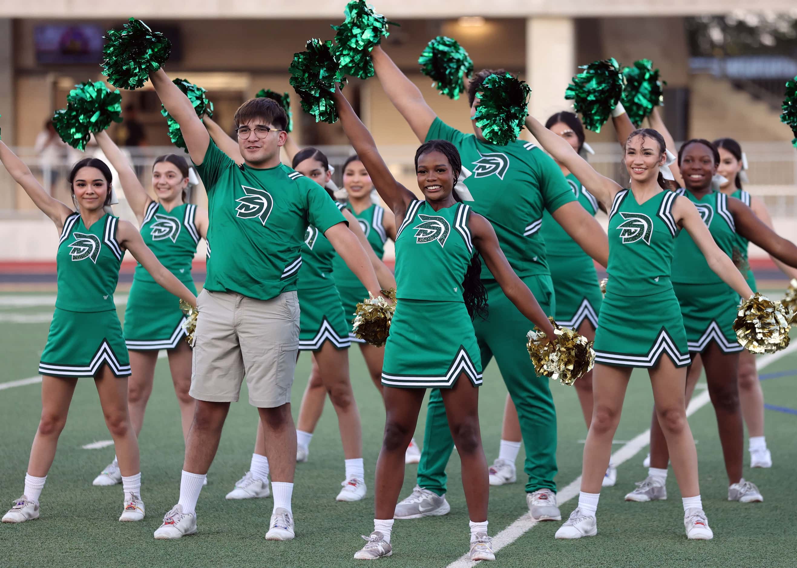 The Newman Smith high cheer squad performs a cheer before the start of the first half of a...