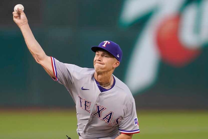 Texas Rangers' Glenn Otto pitches against the Oakland Athletics during the first inning of a...