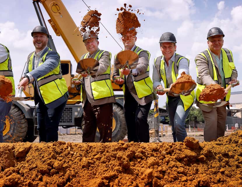 Wednesday's groundbreaking included a dirt toss by Cosm executives Tyler Washburn (from...