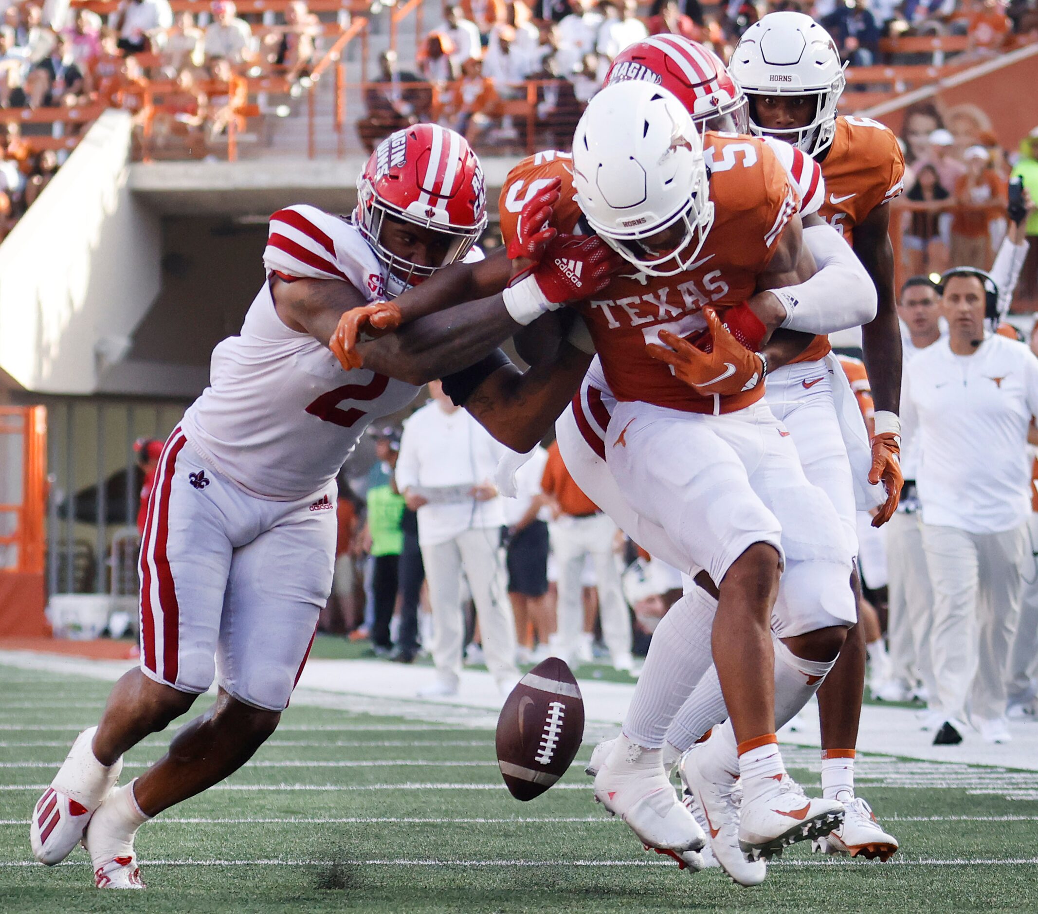 Louisiana-Lafayette Ragin Cajuns linebacker Lorenzo McCaskill (2) forces Texas Longhorns...