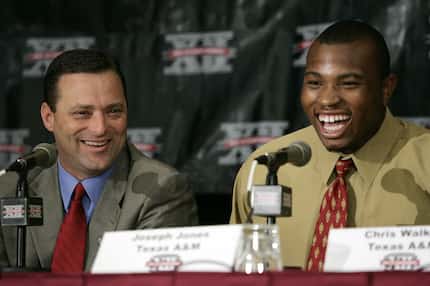 Texas A&M' s Joseph Jones, right, and basketball coach Billy Gillispie, left, laugh as they...