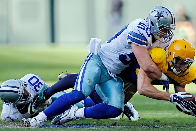Dallas Cowboys outside linebacker Sean Lee (50) finishes off Green Bay Packers wide receiver...