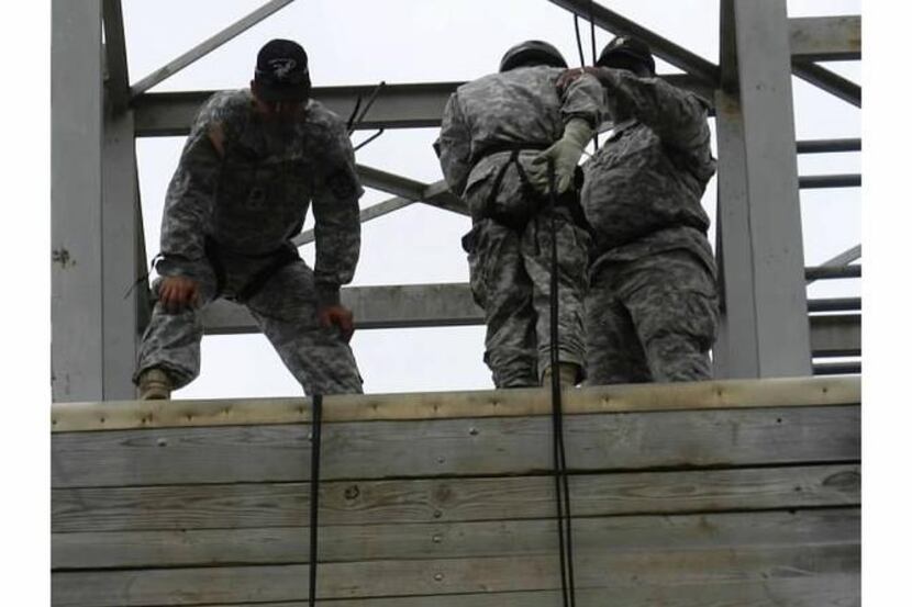 
A JROTC student prepares to rappel down a wall at Camp Bullis. Dallas ISD sent about 300...
