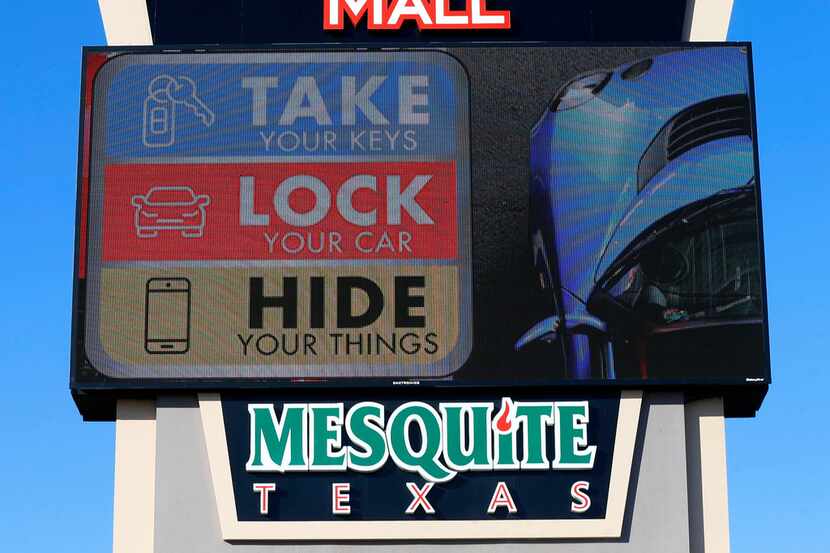 A Take, Lock, Hide sign is seen near the Town East Boulevard exit on Interstate 635 in...