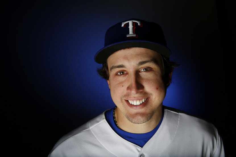 Texas Rangers pitcher Derek Holland stands for a portrait during the Rangers media day in...