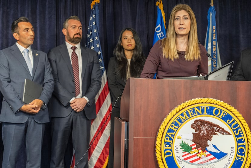 DEA Administrator Anne Milgram, at podium, joins U.S. Attorney Martin Estrada, far left, to...