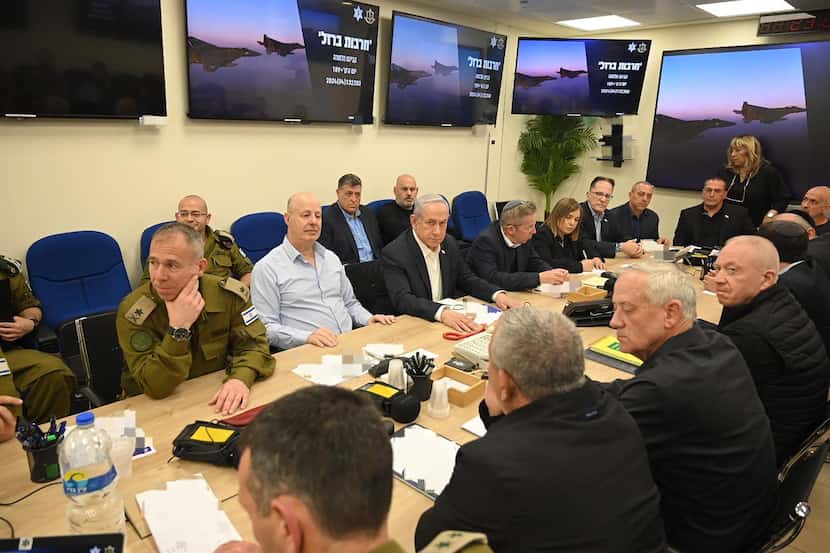 Israel's Prime Minister Benjamin Netanyahu (center) sits in the  War Cabinet meeting at the...