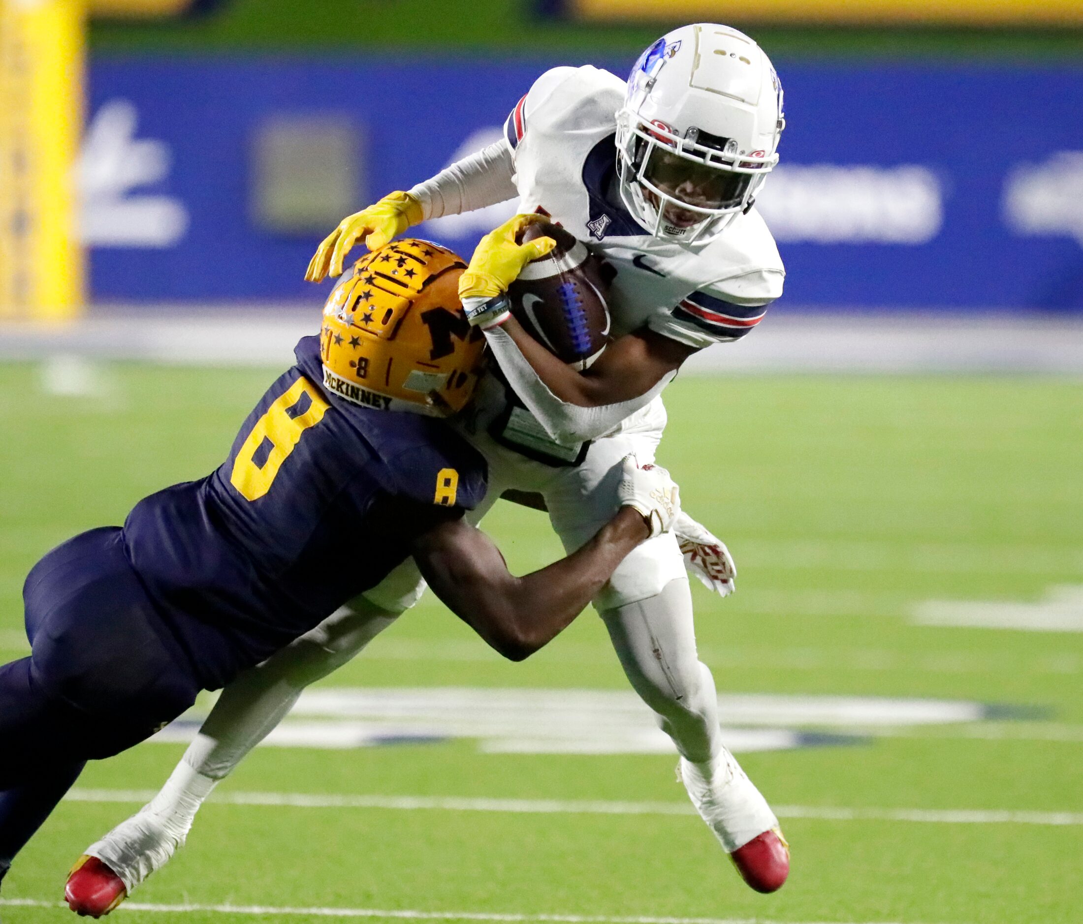 Allen High School wide receiver Donnell Gee Jr (11) is tackled by McKinney High School...