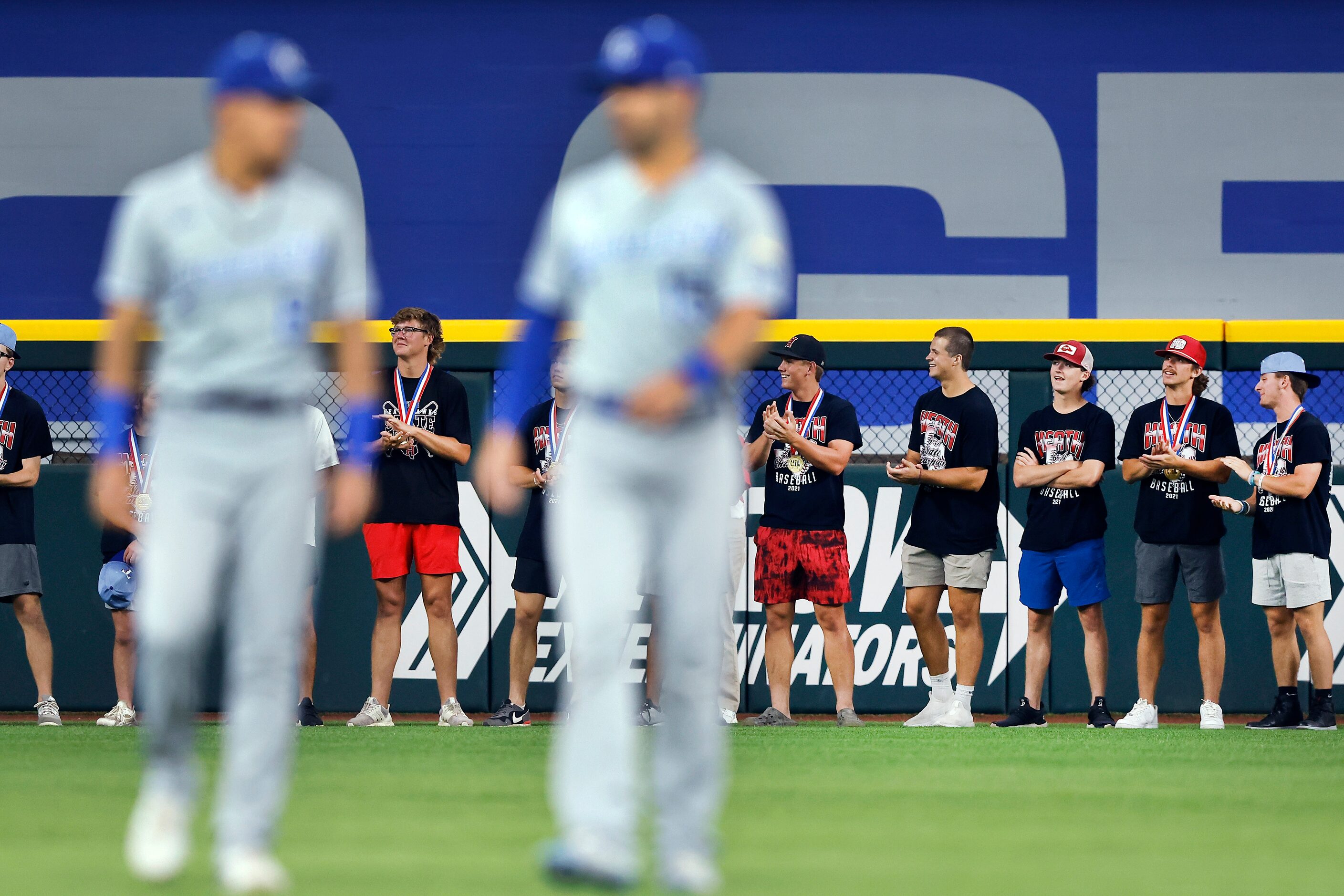 Members of the Rockwall Heath State Champion baseball team is recognized on the field before...