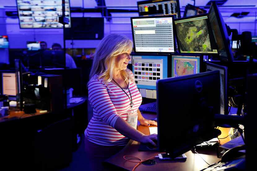 Meteorologist Rebecca Miller monitors the weather in Southwest Airlines NOC (Network...