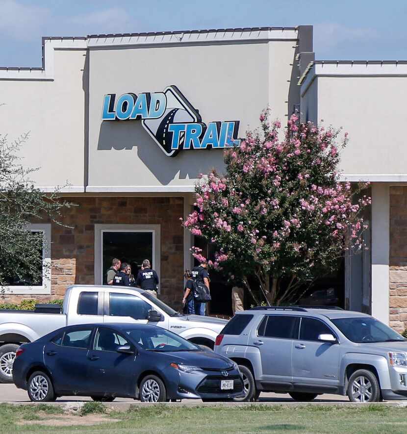 U.S. Immigration and Customs Enforcement agents stood at the front door of Load Trail in...