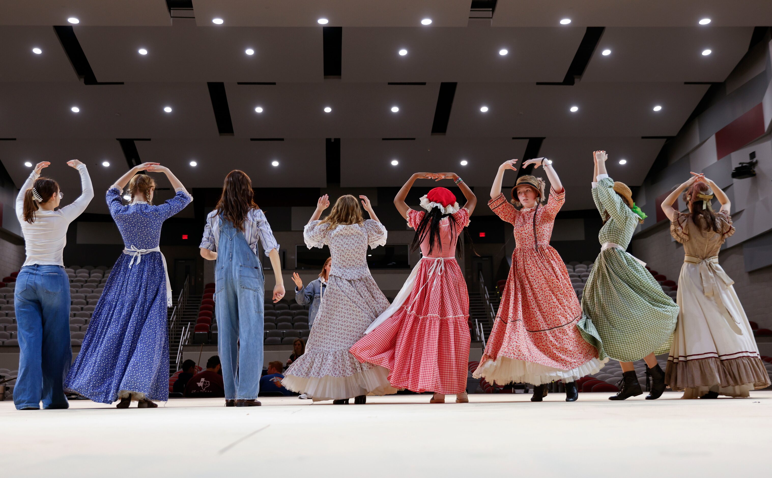 Cast members practice dancing lead by choreographer Nicole Funderburg during a rehearsal for...