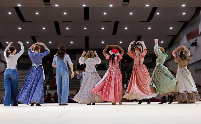 Cast members practice dancing lead by choreographer Nicole Funderburg during a rehearsal for...