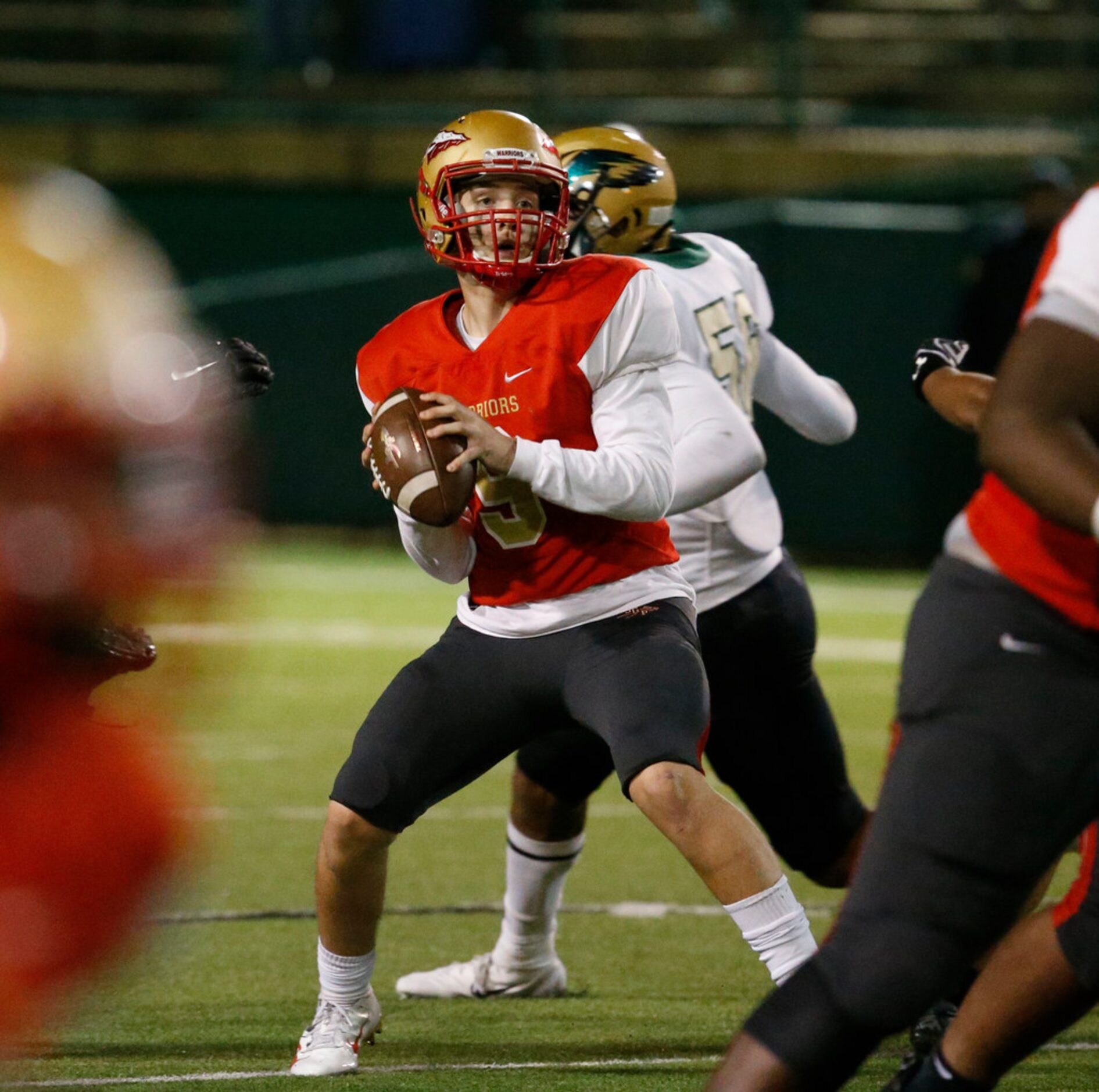 South Grand Prairie's Drake Logan looks for a receiver against Desoto during the first half...