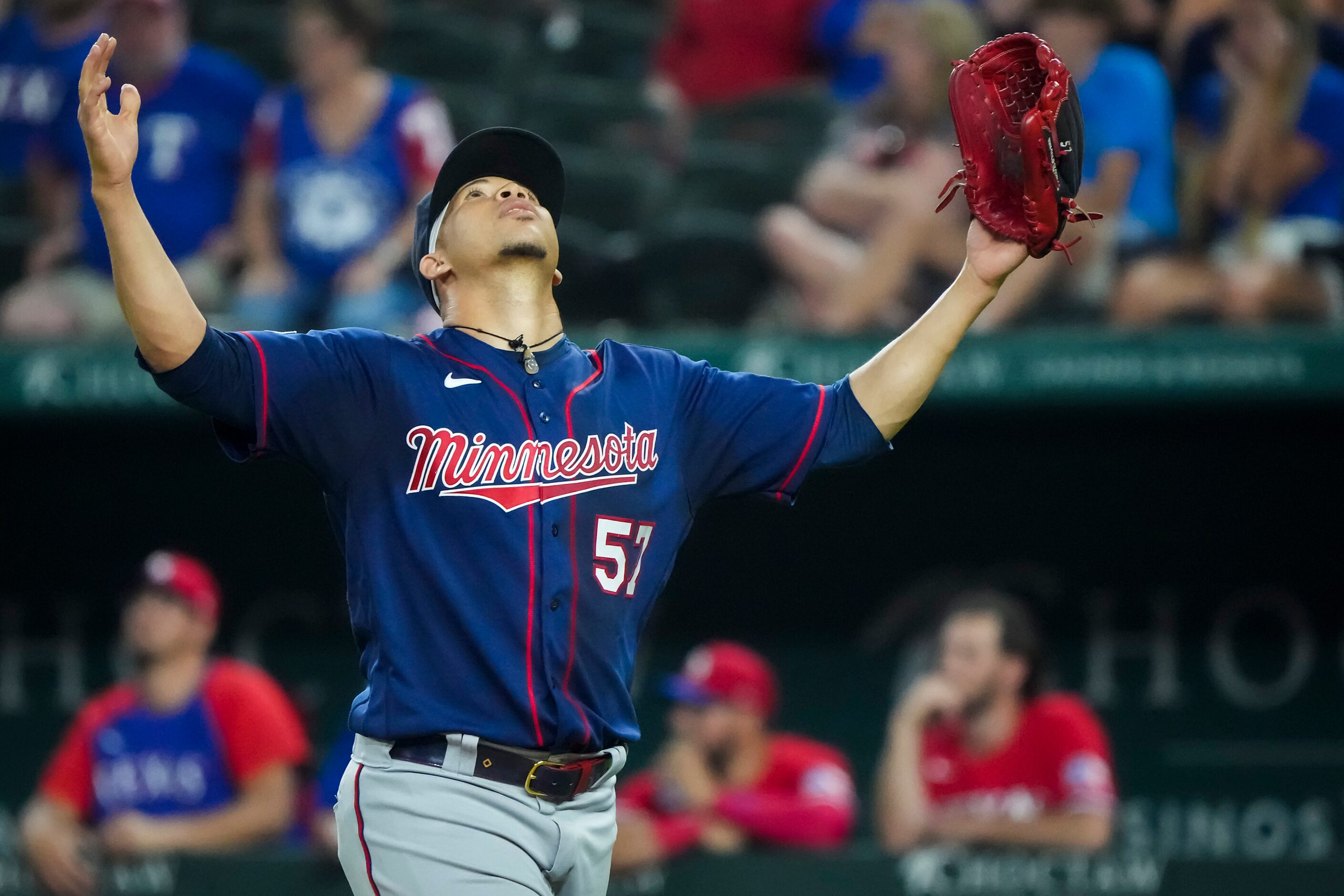 Minnesota Twins relief pitcher Hansel Robles reacts after recording the final out of the...